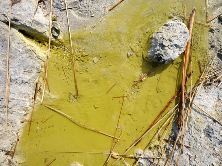 A yellow liquid that gushes from a rift in the earth&#039;s surface on the shores of the lakes of Mount Osorezan.