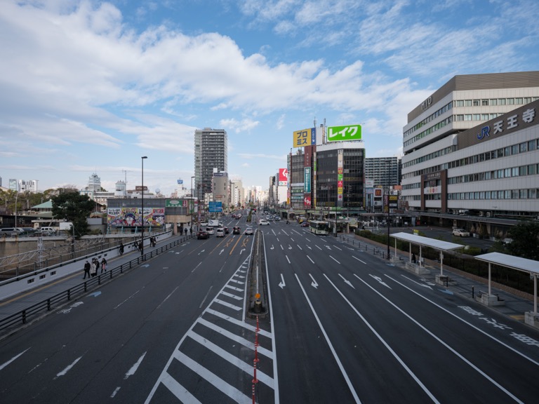 Osaka Tennoji Station pedestrian bridge winter view, quiet New Year’s Eve with sparse crowds and light traffic.